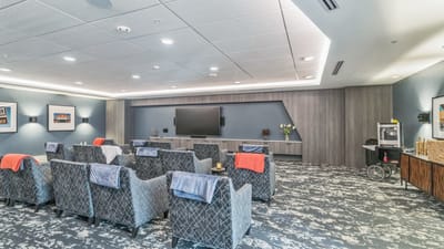 Bright common area with comfortable seating and TV