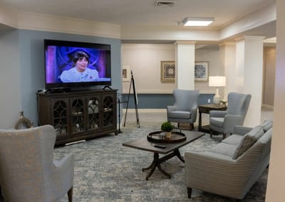 Interior lounge area with comfortable seating and a TV
