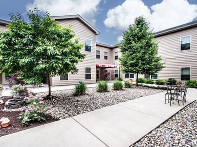 Outdoor courtyard with trees and seating area