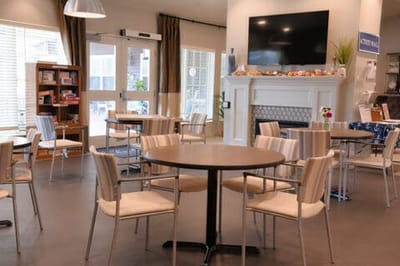 Bright dining area with tables and chairs