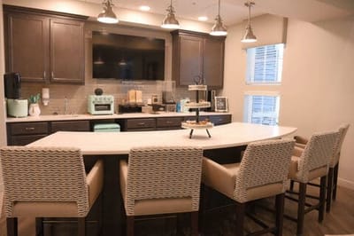 Modern kitchen in a common area with seating
