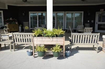 Outdoor seating area with planters and benches