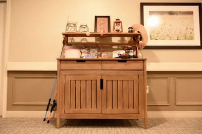 A wooden cabinet with decor items in a facility interior