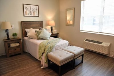 Cozy interior of a resident's room with bed and decor