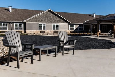 Outdoor seating area with chairs in front of the facility