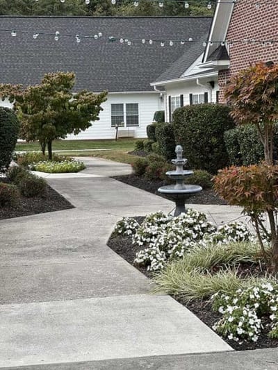 Pathway with fountain and landscaped gardens