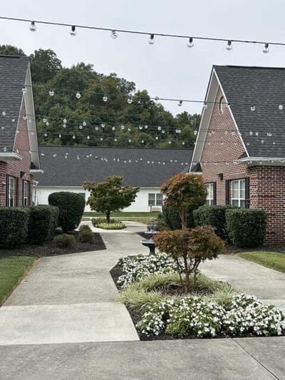 Front pathway with decorative lights and landscaped gardens