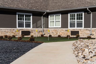 Outdoor putting green with flags and pathway