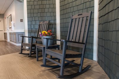 Rocking chairs with flowers in a cozy interior space