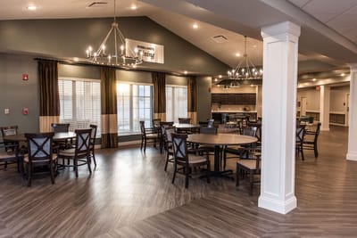 Bright dining room with tables and chairs arranged