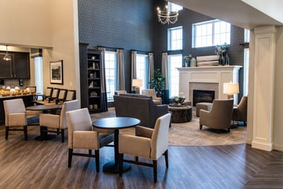 Cozy interior common area with seating and fireplace