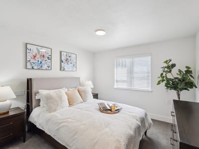 Cozy bedroom with floral decor and a bed