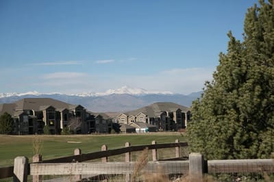 View of assisted living buildings with mountains in the background