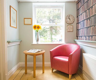 Cozy reading corner with a chair and flowers