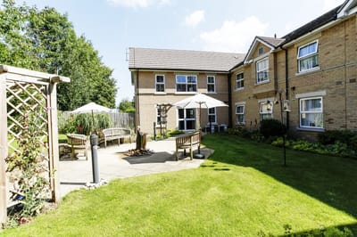 Outdoor seating area with benches and landscaping