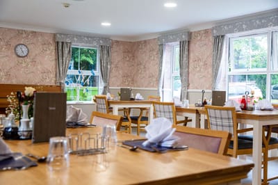 Bright dining room setup with neatly arranged tables
