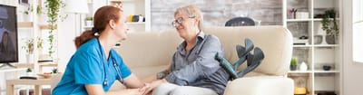 Caregiver interacting with a resident in a living space