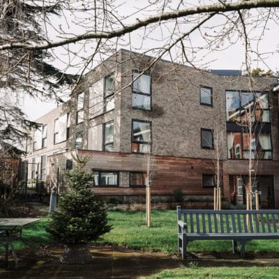 Exterior view of Fairview Court Care Home with outdoor space
