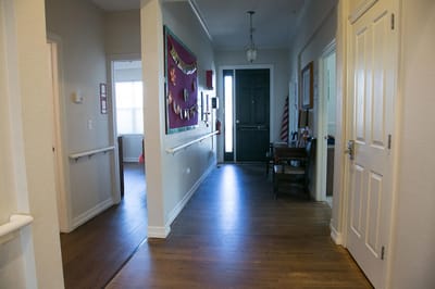 Bright hallway with a door and decorations