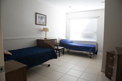 Interior view of a resident room with two beds