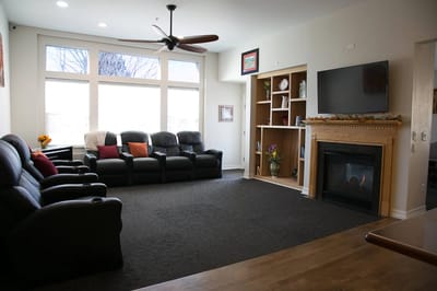 Comfortable common area with seating and a fireplace