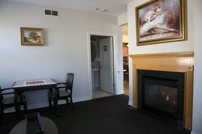 Cozy common area with a fireplace and artwork