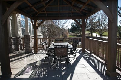 Outdoor seating area with tables and chairs