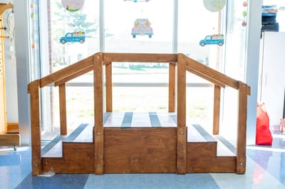 Wooden ramp in a bright facility interior