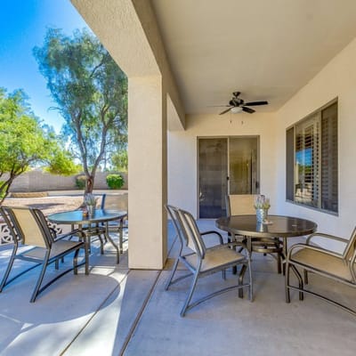 Outdoor seating area with tables and chairs