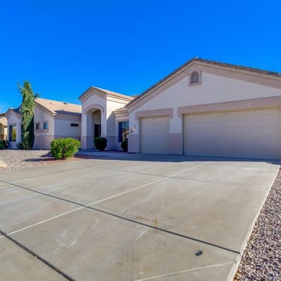 Exterior view of an assisted living facility with a sunny sky