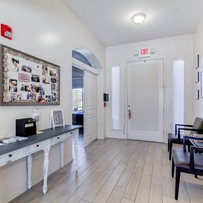 A lobby area with seating and photo display