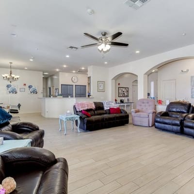 Common area with seating and decor in an assisted living facility