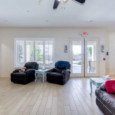Interior view of a cozy common area with recliners