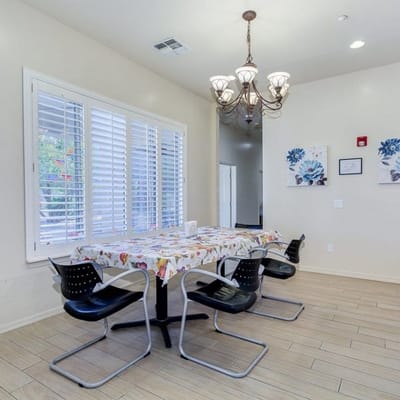 Bright dining area with floral tablecloth