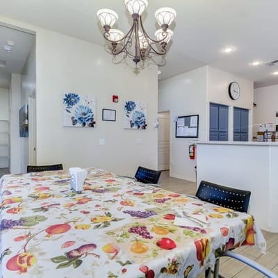 Bright dining area with colorful tablecloth