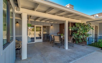 Covered outdoor seating area with plants