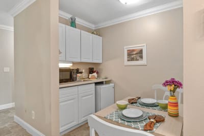 Cozy dining area with a small kitchen setup
