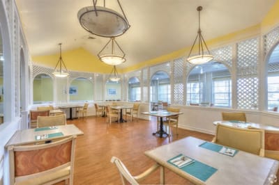 Bright dining room with tables and chairs