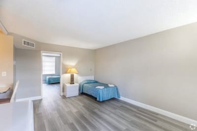 Simple interior view of a resident room with twin beds