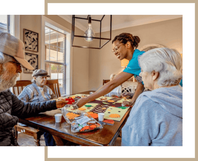 Residents engaging in a craft activity with staff