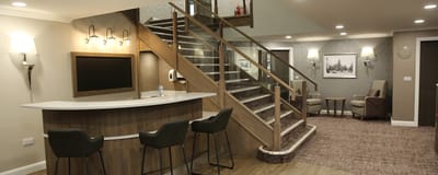 Interior lounge area with seating and staircase