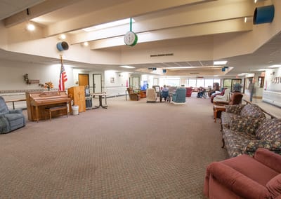 Interior common area with seating and residents