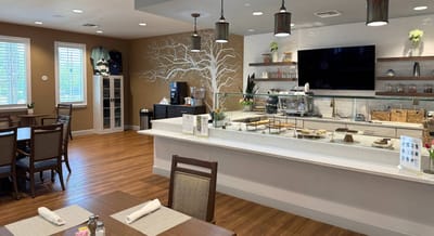 Bright dining area with a clean countertop and seating