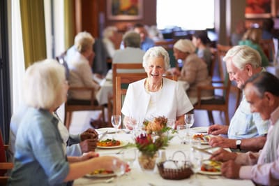 Residents enjoying a meal in the dining room
