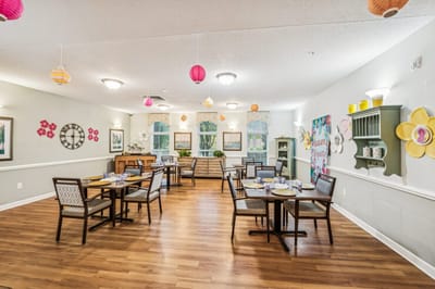 Bright dining room with tables set for meals