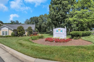 Outdoor view of Cadence at Clemmons facility sign and landscaping