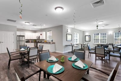 Bright dining area with tables set for a meal