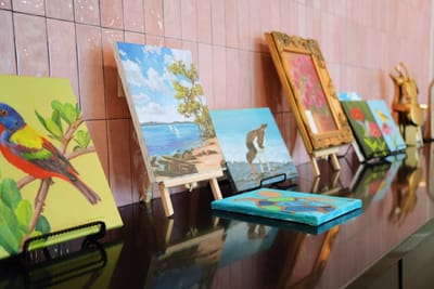Display of resident artwork along a wall