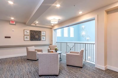 Bright common area with seating and natural light