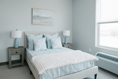 Well-furnished bedroom in a senior living facility
